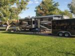 Trailer parked in a RV site at MEADOWS OF SAN JUAN RV RESORT - thumbnail