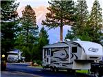 View larger image of Fifth-wheel towed by black pickup truck at FRIENDLY RV PARK image #11