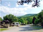View larger image of RVs pulled in at gravel sites at LAKESIDE RV PARK image #1
