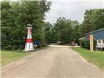 A lighthouse statue next to the entrance at LAKESIDE RV PARK - thumbnail