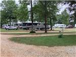 A row of motorhomes parked in RV sites at LAKESIDE RV PARK - thumbnail