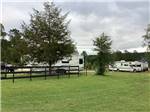 A fifth wheel trailer parked in a site at LAKESIDE RV PARK - thumbnail