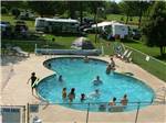View larger image of Kids swimming in pool at SUMMER BREEZE CAMPGROUND  RV PARK image #1