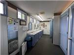 View larger image of Bathroom with sinks and stalls at SUMMER BREEZE CAMPGROUND  RV PARK image #6