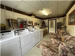 View larger image of Laundry facility with easy chairs for lounging at SUMMER BREEZE CAMPGROUND  RV PARK image #7