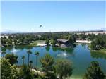 View larger image of Man made lake with water fountain and American flag at LAKESIDE CASINO  RV PARK image #6
