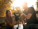 A couple with their dog at SAN DIEGO RV RESORT - thumbnail