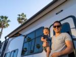 A father and his son standing by the trailer at SAN DIEGO RV RESORT - thumbnail