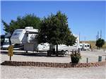 RVs parked in gravel sites at CHEYENNE RV RESORT BY RJOURNEY - thumbnail