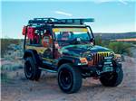 Jeep with park logo in the desert at DESERT SKIES RV RESORT - thumbnail