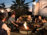 People by the firepit at Arizona Oasis RV Resort - thumbnail