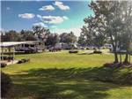 View larger image of A Class A motorhome pulled in to a gravel site at BUSHMANS RV PARK image #2