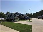 Fifth wheel and other RVs parked on-site at FERNBROOK PARK - thumbnail