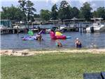 People playing in the water at Taw Caw Campground & Marina - thumbnail