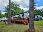 Travel trailer parked at a site at Taw Caw Campground & Marina - thumbnail