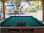 View larger image of Pool table in the game room at HIGHLAND WOODS RV RESORT image #4