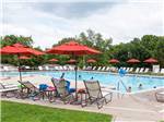View larger image of Swimming pool with outdoor seating at CIRCLE M CAMPING RESORT image #7
