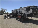 View larger image of Trailer camping at campsite at QUAIL RUN RV PARK image #4