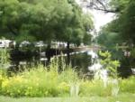 Pond surrounded by campsites - thumbnail