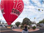 A red hot air balloon getting ready to take off at CORONADO VILLAGE RV RESORT - thumbnail