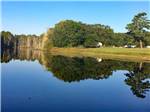 Beautiful, still lake with reflection of trees at BROOKVILLE CAMPGROUND - thumbnail