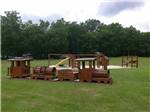 A wooden train playground equipment at BROOKVILLE CAMPGROUND - thumbnail