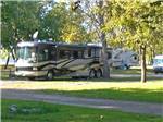 View larger image of A row of grassy RV sites at MILLPOINT RV PARK image #2