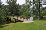 Lake with bridge at site Hickory Holler Campground - thumbnail