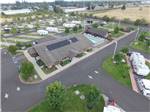 Aerial view over campground, lodge, swimming pool at HEE HEE ILLAHEE RV RESORT - thumbnail