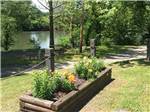 A flower planter box along the water at WATERSIDE CAMPGROUND & RV PARK - thumbnail