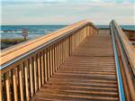 A wood bridge to the ocean at DELLANERA RV PARK - thumbnail