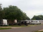 RVs at tree-lined sites at SWEET GUM MOBILE HOME AND RV COMMUNITY - thumbnail