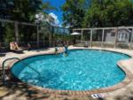 Children playing in the pool at LIVE OAK LANDING RV PARK - thumbnail