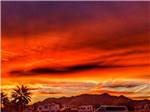 An orange and red sky at dusk at ENCORE PILOT KNOB - thumbnail