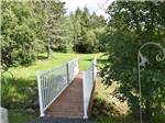 A wooden walking bridge at THE WILLOWS RV PARK & CAMPGROUND - thumbnail