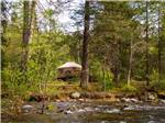 Yurt camping next to the river at THOUSAND TRAILS YOSEMITE LAKES - thumbnail