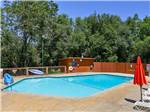 Swimming pool with outdoor seating at THOUSAND TRAILS LAKE OF THE SPRINGS - thumbnail