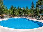 View larger image of Swimming pool with outdoor seating at IDYLLWILD RV RESORT image #3