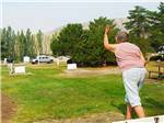 View larger image of 2 women playing horseshoes at CRESCENT BAR image #2
