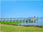 Pier on lake with people fishing at THOUSAND TRAILS VIRGINIA LANDING - thumbnail