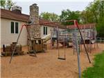 Playground with swing set at APPALACHIAN CAMPING RESORT - thumbnail