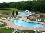 View larger image of Swimming pools with outdoor seating at SCOTRUN RV RESORT image #2