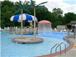 View larger image of Swimming pool with umbrellas in the middle at SCOTRUN RV RESORT image #4