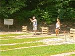 Couple playing horseshoes at THOUSAND TRAILS GREEN MOUNTAIN - thumbnail