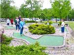 View larger image of Campers playing miniature golf at SAINT CLAIR THOUSAND TRAILS image #5