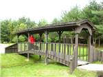 View larger image of Lady crossing bridge at SAINT CLAIR THOUSAND TRAILS image #6