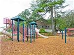 View larger image of Playground in front of lodge at STURBRIDGE RV RESORT image #3