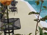 A seating area by the swimming pool at FRESNO MOBILE HOME & RV PARK - thumbnail