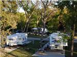 Travel trailers parked at shaded sites - thumbnail