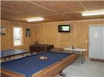 Our game room includes pool, ping pong, and foosball tables at BEAVER RUN RV PARK - thumbnail